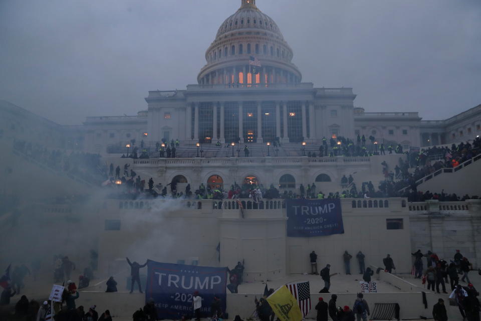 Police officers stand guard as supporters of U.S. President Donald Trump gather in front of the U.S. Capitol Building in Washington, U.S., January 6, 2021. REUTERS/Leah Millis