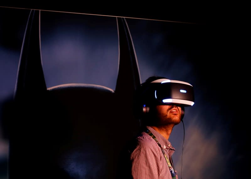 People try the new Sony VR headset during Sony's E3 2016 event. (REUTERS/Mike Blake)