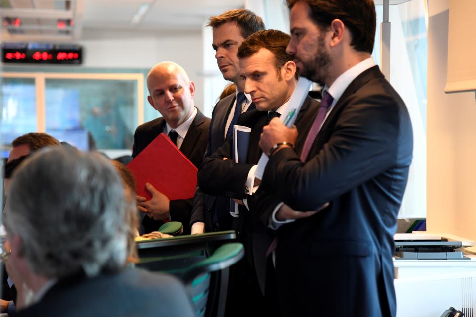 French President Emmanuel Macron (2R) flanked by French Health and Solidarity Minister Olivier Veran (2L) and French Director General of Health Jerome Salomon (L) visit the CORRUSS center (Centre operationnel de regulation et de reponse aux urgences sanitaires et sociales) focused on the novel Coronavirus (Covid-19) outbreak on March 3, 2020 in Paris. (Photo by Bertrand GUAY / POOL / AFP) (Photo by BERTRAND GUAY/POOL/AFP via Getty Images)