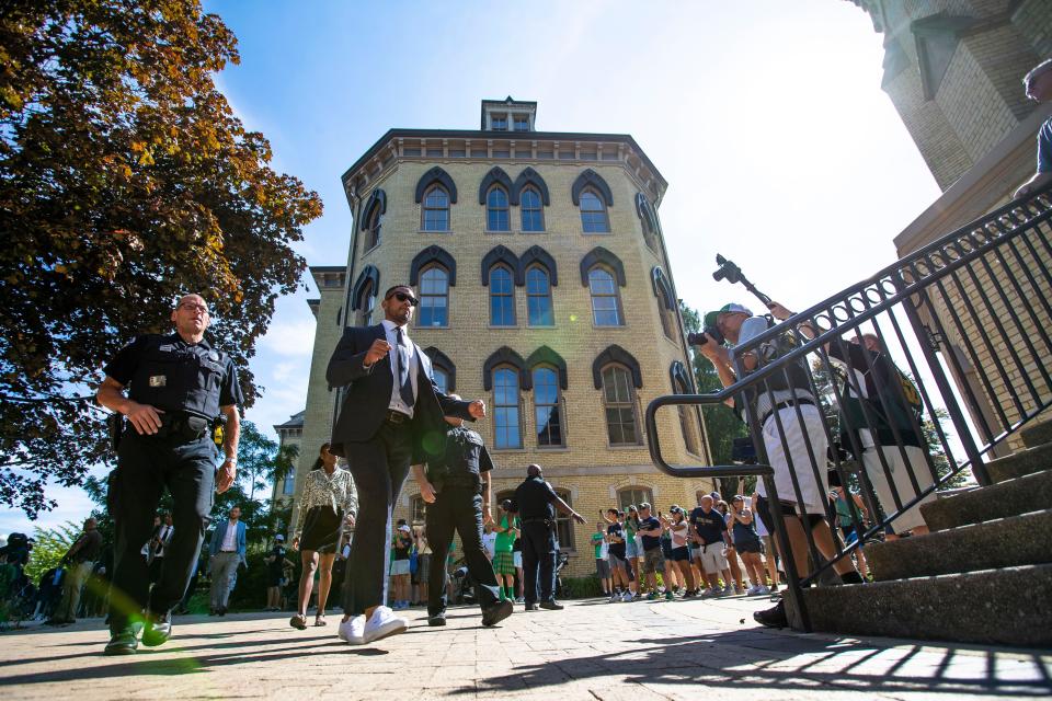 Notre Dame head coach Marcus Freeman walks into the Basilica of the Sacred Heart before the Notre Dame vs. Marshall NCAA football game Saturday, Sept. 10, 2022 at Notre Dame Stadium in South Bend.