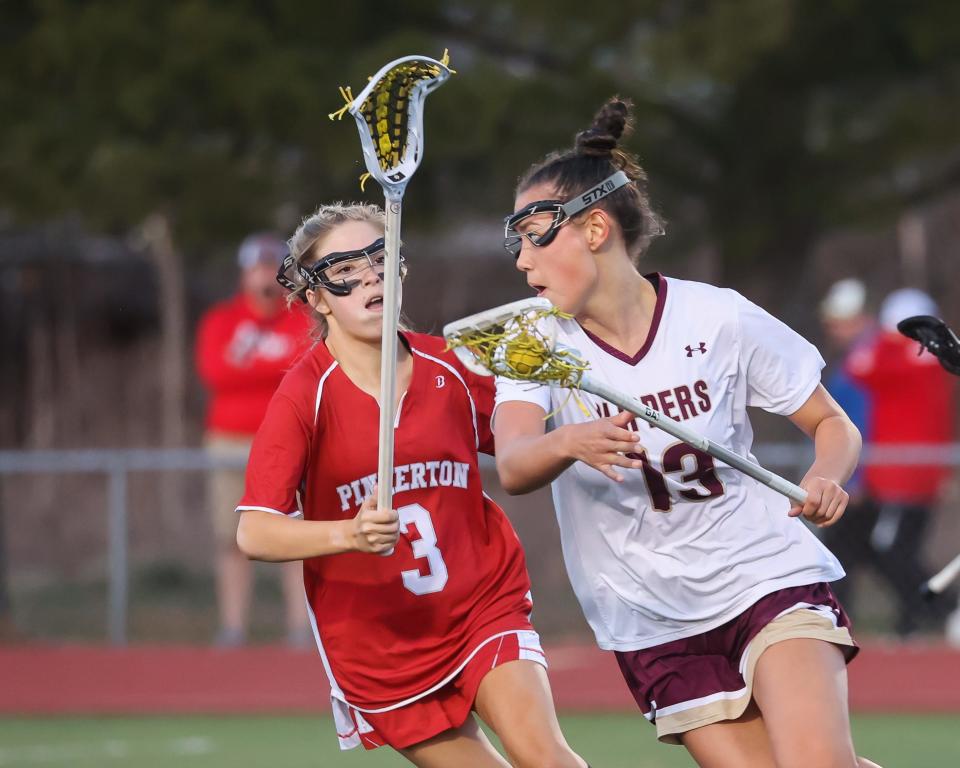 Portsmouth's Avery Ruhnke right, seen here earlier this season, had three goals and three assists in Monday's 17-0 win over Merrimack.