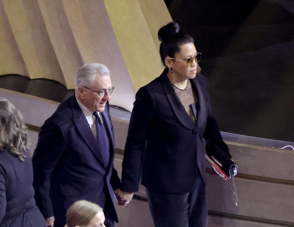 Tiffany Chen and Robert De Niro hold hands (Getty Images)