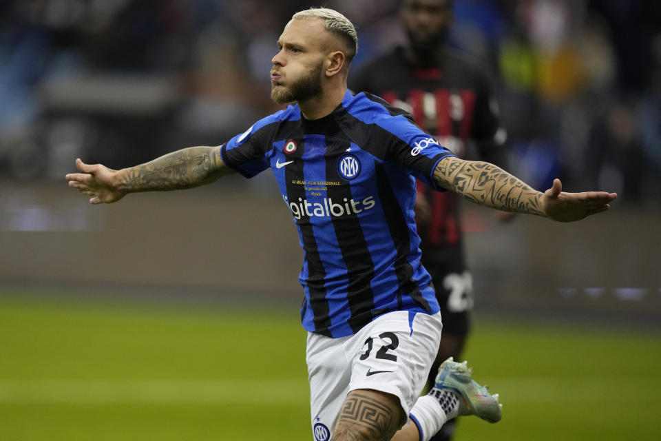 Inter Milan's Federico Dimarco celebrates after scoring his side's opening goal during the Italian Super Cup final soccer match between AC Milan and Inter Milan at the King Saud University Stadium, in Riyadh, Saudi Arabia, Wednesday, Jan. 18, 2023. (AP Photo/Hussein Malla)