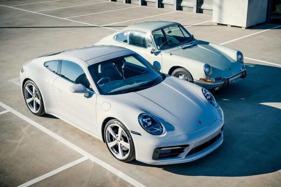 A modern Porsche 911 Carrera S and a 1965 Porsche 911 in Australia in 2020.