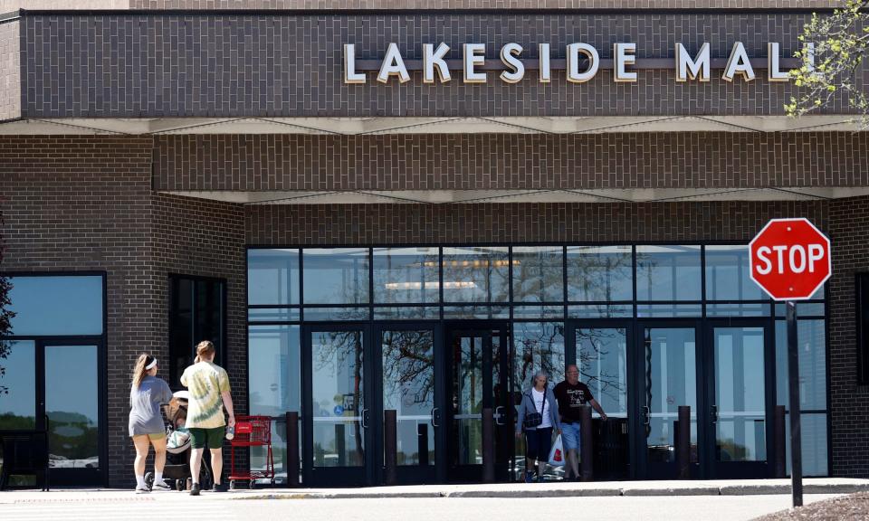 People walk in and out of Lakeside Mall in Sterling Heights on Tuesday, April 30, 2024.