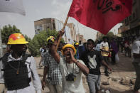 Anti-military protesters march on Friday, July 1, 2022 in Khartoum, Sudan, a day after nine people were killed in demonstrations against the country’s ruling generals. (AP Photo/Marwan Ali)