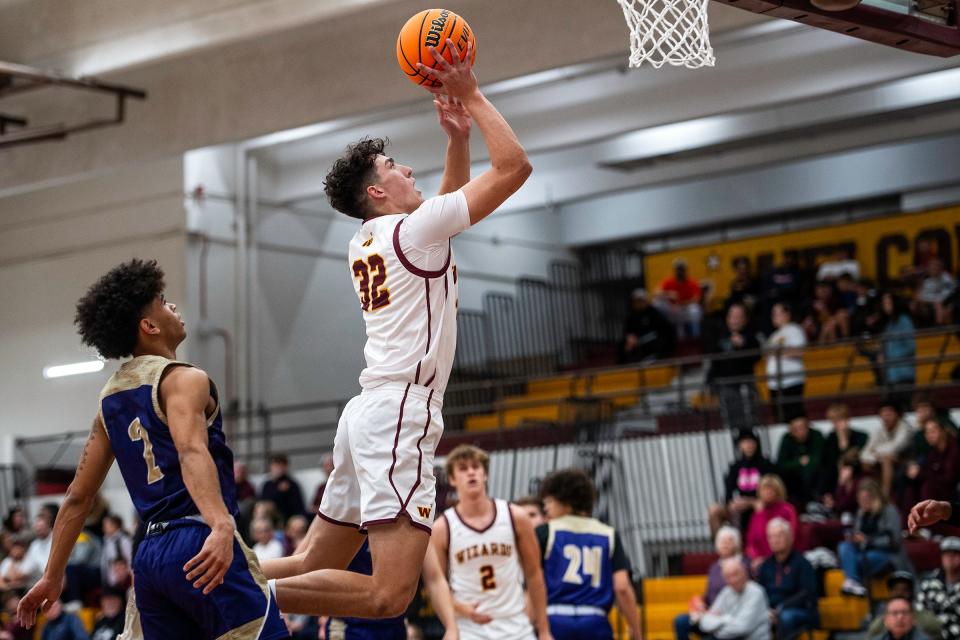 Windsor's Johnathan Reed(32) drives to the hoop during a game against Fort Collins High School in Windsor on Tuesday, Dec. 5, 2023.