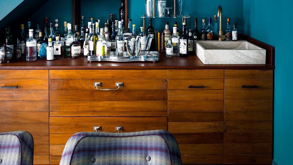 a counter with bottles of alcohol on it