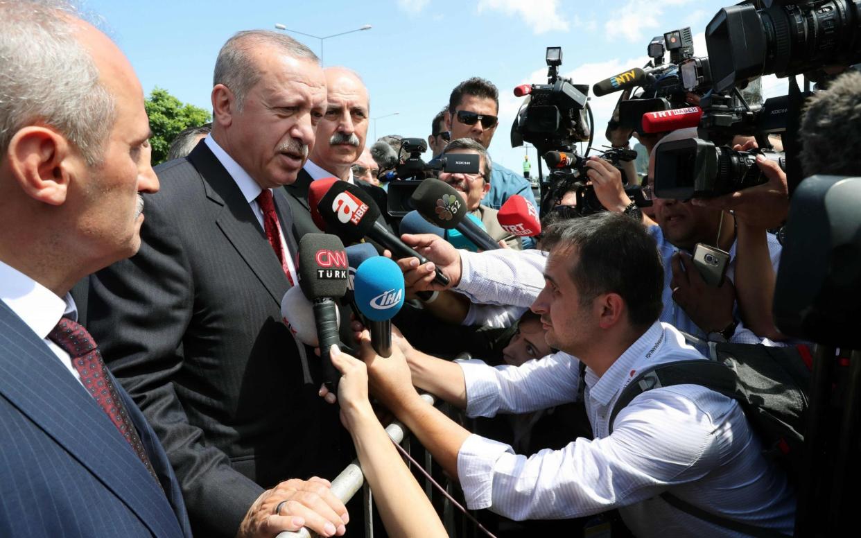 Turkish President Recep Tayyip Erdogan speaking to journalists during a press conference in the Black Sea province of Ordu - AFP