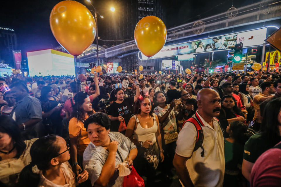 People celebrate during the New Year countdown at Bukit Bintang in Kuala Lumpur January 1, 2020. — Picture by Firdaus Latif