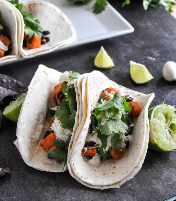 <strong>Get the <a href="http://www.howsweeteats.com/2012/12/embarrassingly-easy-smoky-sweet-potato-and-black-bean-tacos/" target="_blank">Smoky Sweet Potato and Black Bean Tacos recipe</a> by How Sweet It Is</strong>