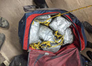 FILE - This undated photo provided on Jan. 24, 2020 by U.S. Customs and Border Protection shows some of over 165 pounds (75 kilograms) of suspected methamphetamine seized after smugglers tried to float it across the border from Nogales, Mexico, by roping together dozens of packages and sending them through an underground drainage tunnel into Arizona, according to federal officials. The U.S. Drug Enforcement Administration quietly removed Nicholas Palmeri, its top official in Mexico, in 2022 over improper contact with lawyers for narcotraffickers, an embarrassing end to a brief tenure marked by deteriorating cooperation between the countries and a record flow of cocaine, heroin and fentanyl across the border. (U.S. Customs and Border Protection via AP, File)