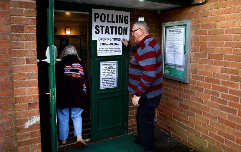 A lady enters a polling station during local elections in Keele