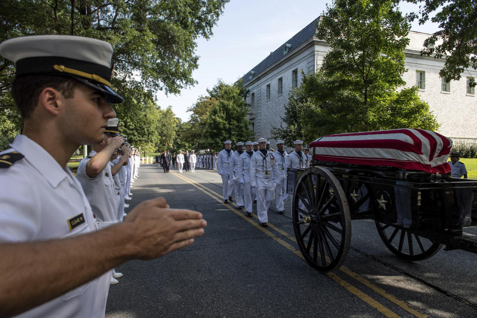 <p>In this image proved by the U.S. Navy, Midshipmen salute the casket of Sen. John McCain, R-Ariz., as a horse-drawn caisson transports his flag-draped casket to the United States Naval Academy Cemetery for his burial service, Sunday, Sept. 2, 2018. (Photo: Mass Communication Specialist 2nd Class Nathan Burke/U.S. Navy via AP) </p>