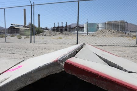 A sidewalk next to the Searles Valley Minerals plant is buckled from a powerful magnitude 7.1 earthquake broke, triggered by a 6.4 the previous day, near the epicenter in Trona, California