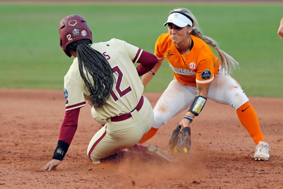Florida State's Amaya Ross, left, steals second base against Tennessee's Mackenzie Donihoo during the sixth inning of an NCAA softball Women's College World Series game Monday, June 5, 2023, in Oklahoma City. (AP Photo/Nate Billings)