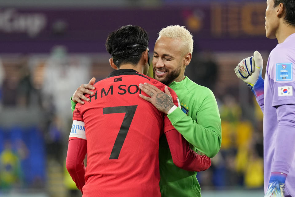 South Korea's Son Heung-min, left, greets Brazil's Neymar before the start of the World Cup round of 16 soccer match between Brazil and South Korea, at the Education City Stadium in Al Rayyan, Qatar, Monday, Dec. 5, 2022. (AP Photo/Martin Meissner)