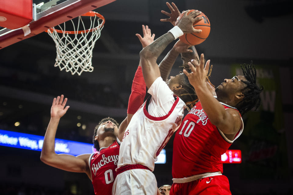 Ohio State's Tanner Holden, left, and Brice Sensabaugh defend against Nebraska's Denim Dawson during an NCAA college basketball game Wednesday, Jan. 18, 2023, in Lincoln, Neb. (Justin Wan/Lincoln Journal Star via AP)