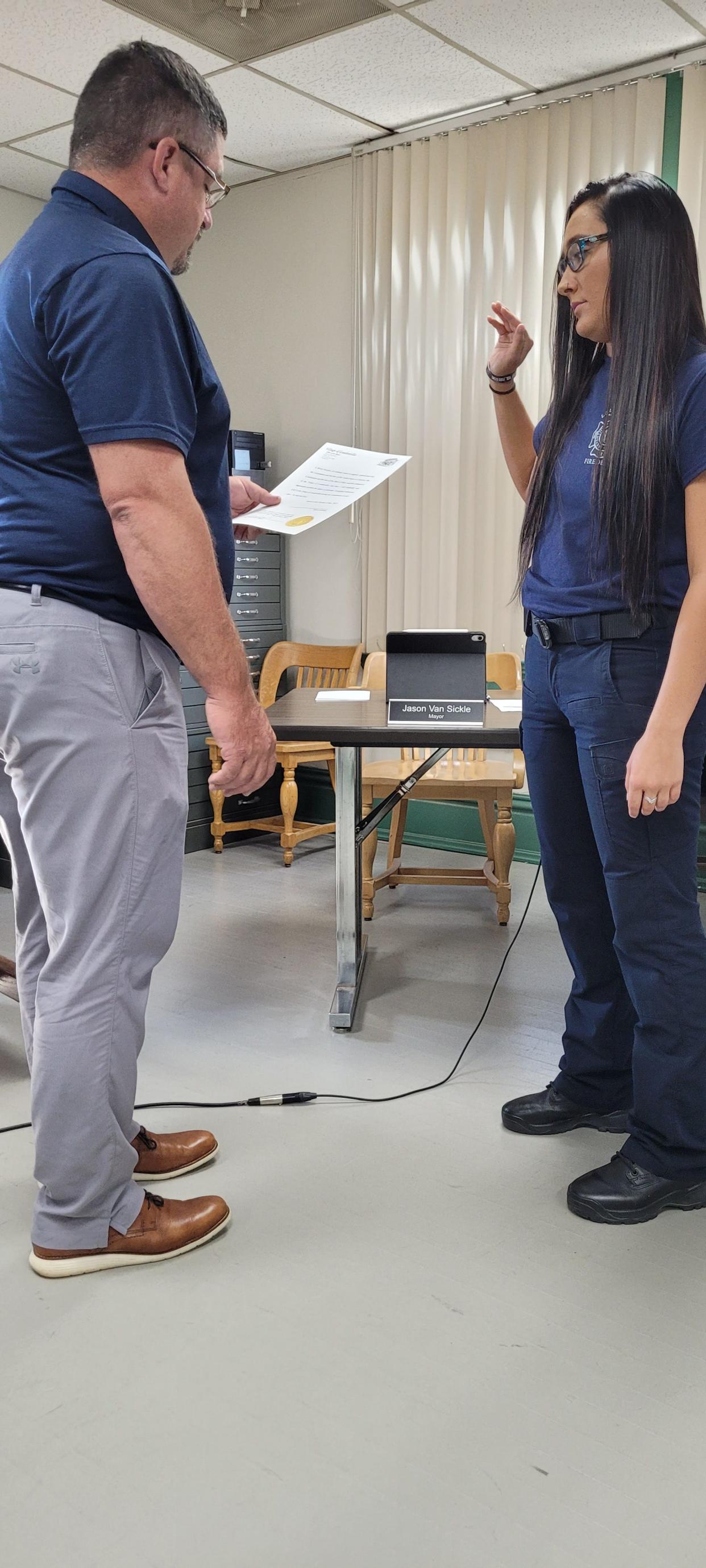 Mayor Jason VanSickle administers the oath of office to new Loudonville firefighter/advanced EMT Sierra Goolsby during the council meeting Tuesday, July 5