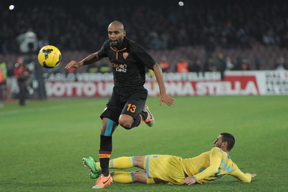 AS Roma Maicon dribbles past a player of Napoli during an Italian Cup, semifinal return match, between AS Roma and Napoli, at the San Paolo stadium in Naples, Italy, Wednesday, Feb. 12, 2014. Napoli won 3 - 0 to advance to the final. (AP Photo/Giorgio Gennaro)