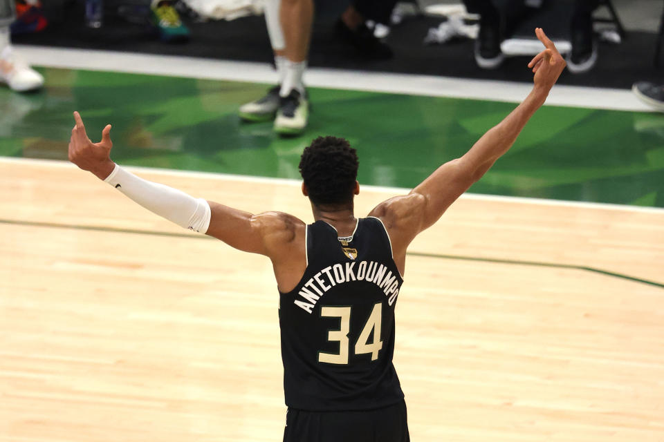 Giannis Antetokounmpo celebrates after defeating the Phoenix Suns in Game Six to win the 2021 NBA championship at Fiserv Forum on July 20, 2021 in Milwaukee. (Jonathan Daniel/Getty Images)