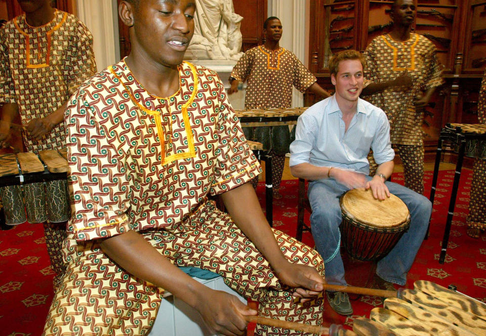 Prince William plays the drums as the Shakarimba band, who have been flown in from Botswana to perform at the Prince's 21st birthday party on June 21, rehearse in the Queen's Guard Chamber at Windsor Castle. The Prince has chosen an "Out of Africa" theme for his party and the more than 300 family and friends who have been invited have been asked to wear fancy dress. (Photo by Anwar Hussein/WireImage)