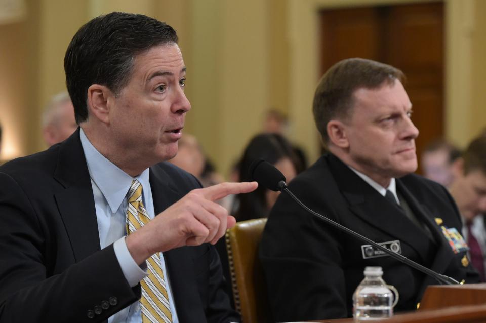 FBI Director James Comey gestures as National Security Agency Director Mike Rogers looks on during the House Permanent Select Committee on Intelligence hearing on Russian actions during the 2016 election. (Photo: Mandel Ngan/AFP/Getty Images)