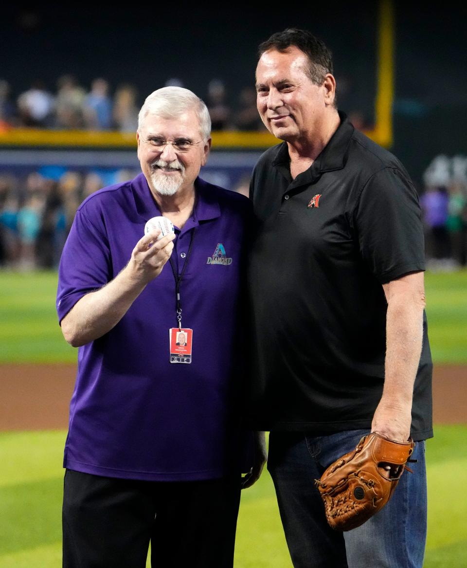 Arizona Diamondbacks radio broadcaster Greg Schulte poses with Tom Candiotti (right) during a ceremony honoring his 26-year career at Chase Field.