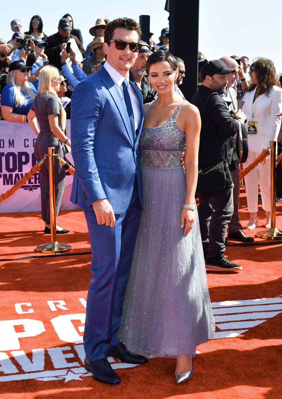 Actor Miles Teller and his wife Keleigh Sperry attend the world premiere of "Top Gun: Maverick!" aboard the USS Midway in San Diego, California on May 4, 2022. (Photo by Robyn Beck / AFP) (Photo by ROBYN BECK/AFP via Getty Images)