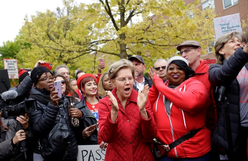 Democratic presidential candidate Senator Elizabeth Warren yells as she visits a picket line of striking teachers in Chicago