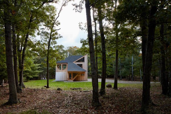 The wood-clad retreat sits across the street from a nature preserve, offering easy access to multiple hiking and mountain-biking trails. The beach is also just a short walk away.