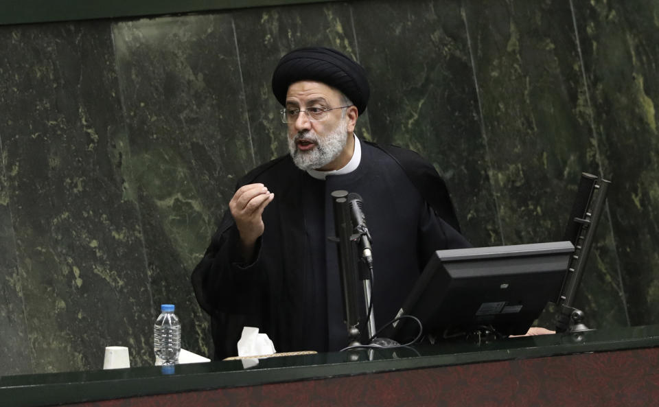 President Ebrahim Raisi defends his proposed ministers in a session of parliament, in Tehran, Iran, Wednesday, Aug. 25, 2021. Iran's hard-liner dominated parliament Wednesday voted to approve most of the proposed ministers of the newly elected president. (AP Photo/Vahid Salemi)