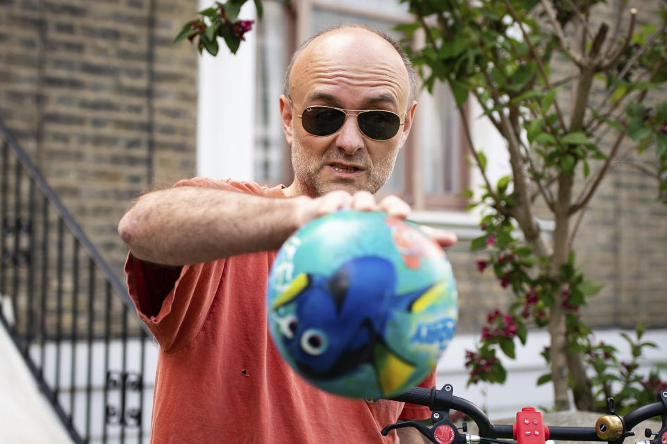 Britain's Prime Minister Boris Johnson's senior aid Dominic Cummings leaves his home, in London, Saturday May 23, 2020. The British government faced accusations of hypocrisy on Saturday after the revelation that Prime Minister Boris Johnson’s top adviser Cummings, traveled more than 250 miles (400 kms) to his parents’ house during a nationwide lockdown while he was showing coronavirus symptoms. (Aaron Chown/PA via AP)