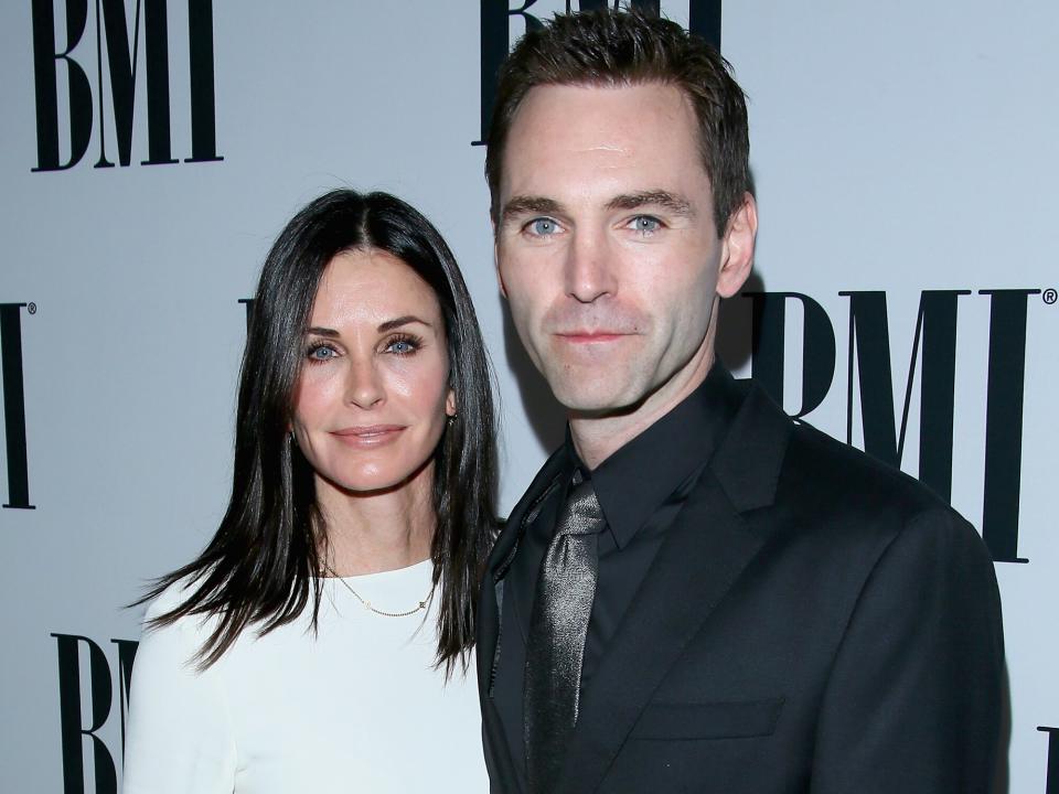 Courtney Cox (L) and musician Johnny McDaid of Snow Patrol attend the 64th Annual BMI Pop Awards held at the Beverly Wilshire Four Seasons Hotel on May 10, 2016 in Beverly Hills, California