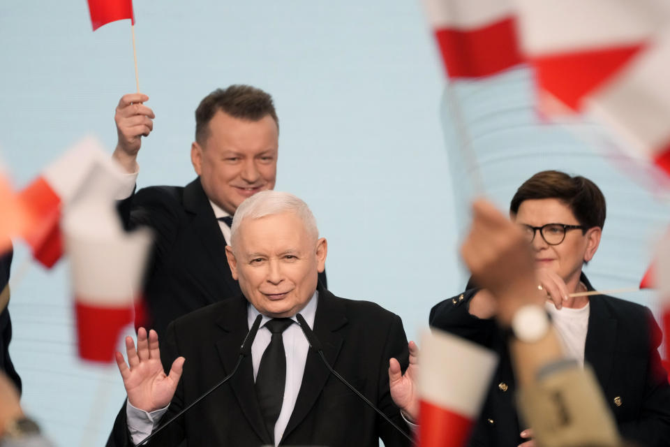 Conservative Law and Justice party leader Jaroslaw Kaczynski, center, waves to supporters during regional and local elections in Warsaw, Poland, Sunday April 7, 2024. The vote is the first test at the ballot box for Prime Minister Donald Tusk four months after he took office. (AP Photo/Czarek Sokolowski)
