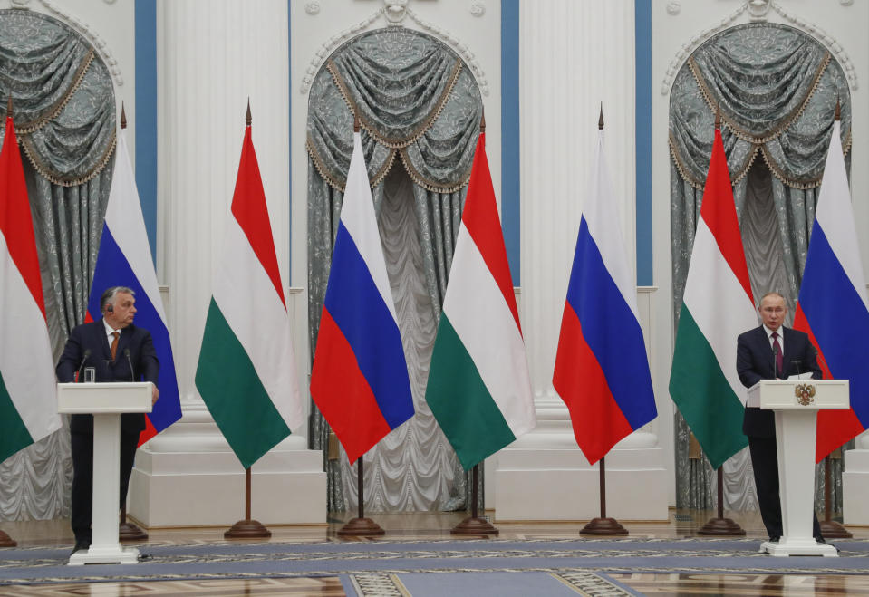 FILE - Hungary's Prime Minister Viktor Orban, left, and Russian President Vladimir Putin attend a joint news conference following their talks in the Kremlin in Moscow, Russia, Tuesday, Feb. 1, 2022. Rarely in recent years has the Kremlin been so popular with European visitors. French President Emmanuel Macron arrives Monday, Feb. 7, 2022. The Hungarian prime minister visited last week. And in days to come, the German chancellor will be there, too. (Yuri Kochetkov/Pool Photo via AP)