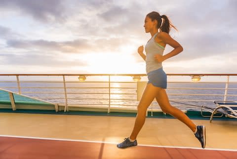 A woman running on a track on a cruise ship - Credit: AP