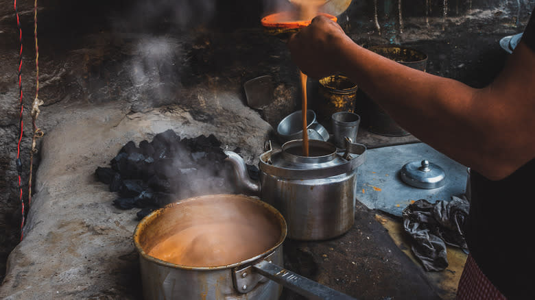 person preparing chai tea