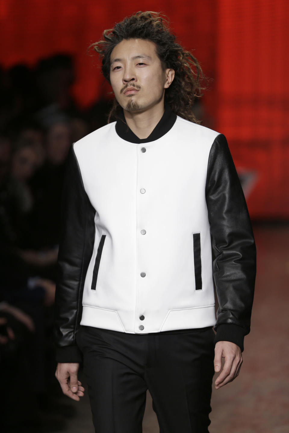 The Fall 2014 DKNY collection is modeled during Fashion Week in New York, Sunday, Feb. 9, 2014. (AP Photo/Seth Wenig)