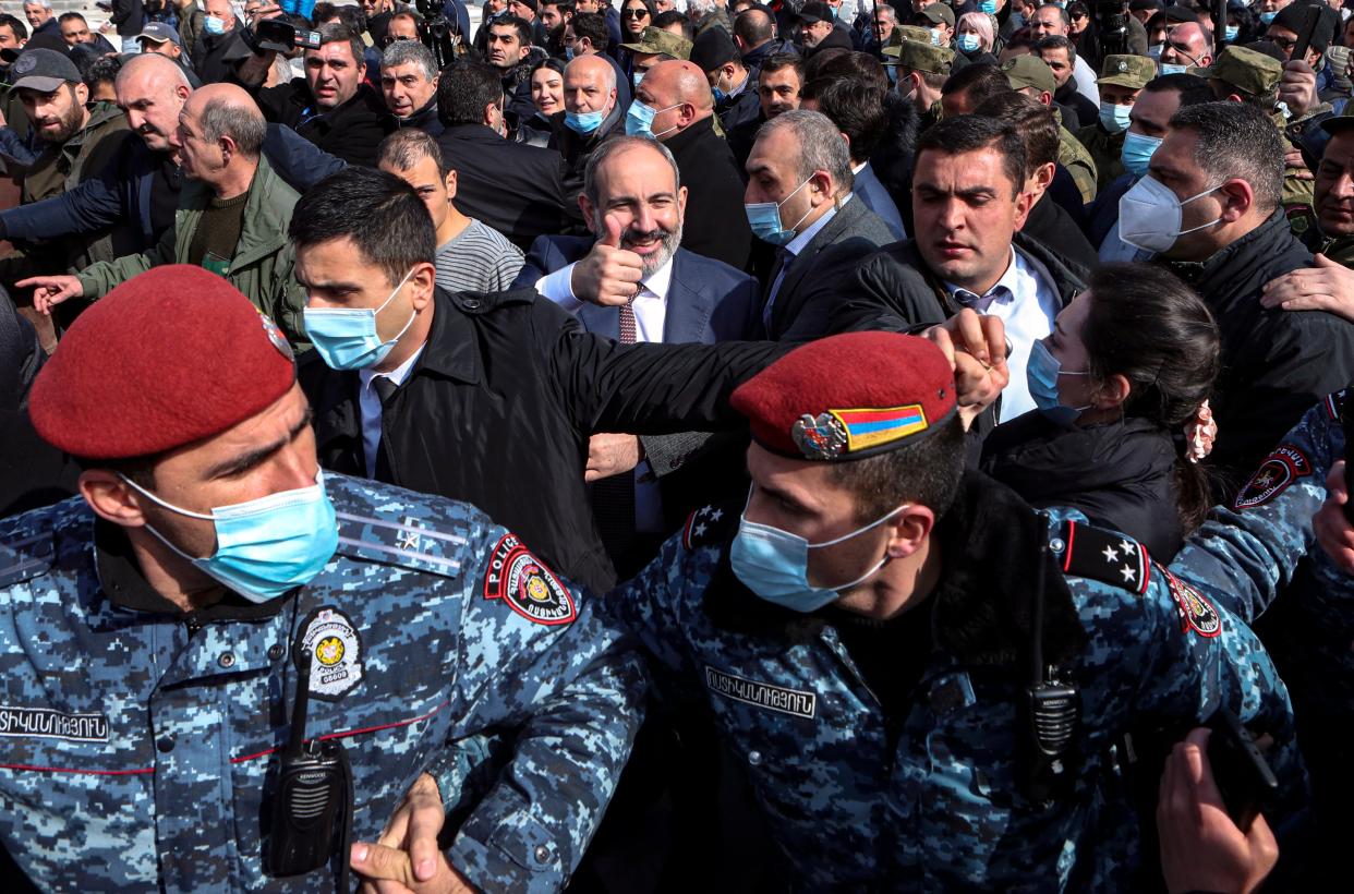 <p>Nikol Pashinyan (centre) greets people while walking with his supporters on the streets in downtown of Yerevan, Armenia</p> (EPA)