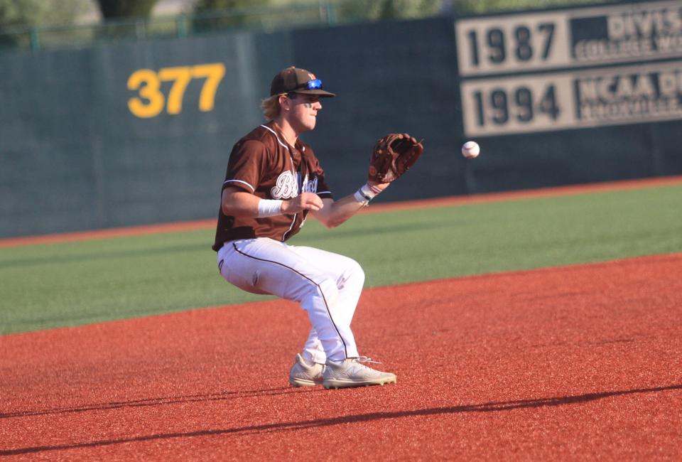 Heath's Kaden Green starts an inning-ending double play during the Bulldogs' 6-2 victory over Greeneview in a Division III regional final on Friday.