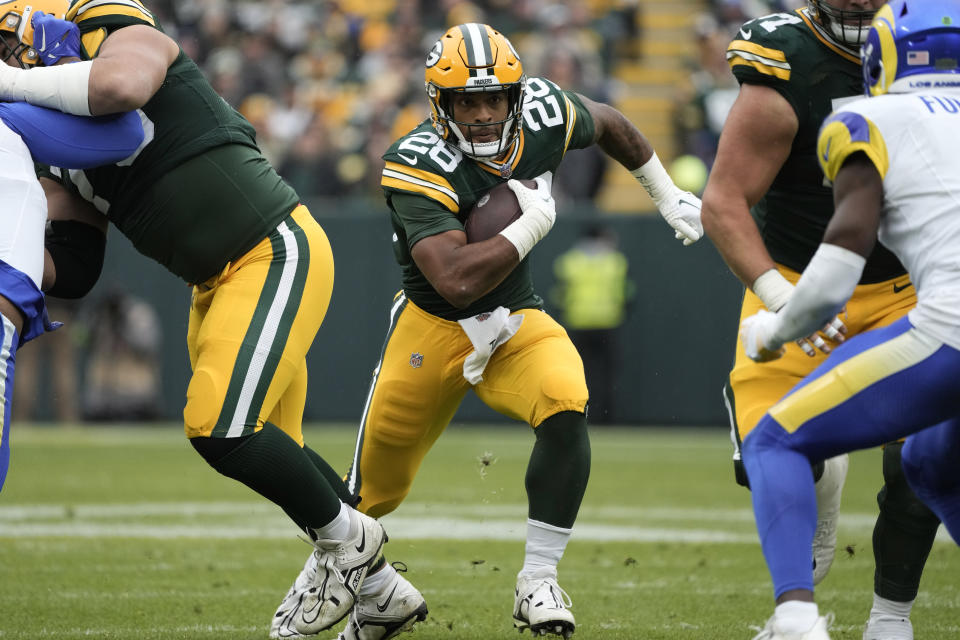 Green Bay Packers running back AJ Dillon (28) runs with the football during the first half of an NFL football game against the Los Angeles Rams, Sunday, Nov. 5, 2023, in Green Bay, Wis. (AP Photo/Morry Gash)