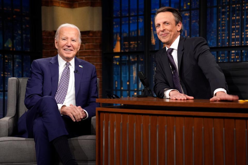 President Joe Biden talks with Seth Meyers during a taping of the "Late Night with Seth Meyers" Monday, Feb. 26, 2024, in New York. (AP Photo/Evan Vucci)