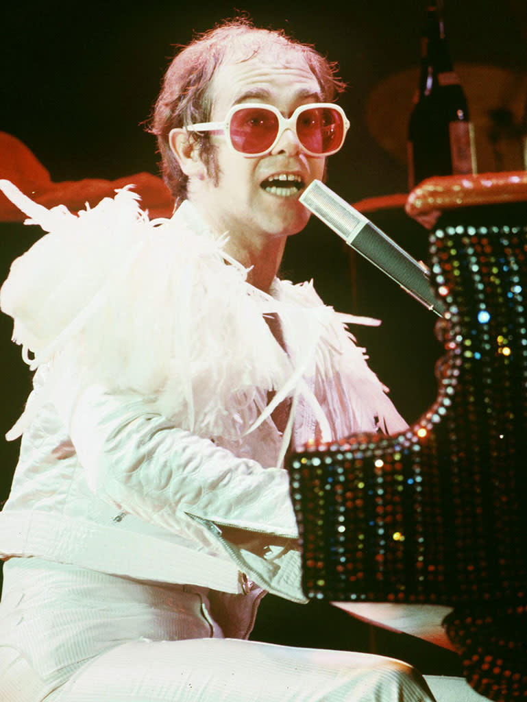 Elton John wearing rose-colored glasses in 1975