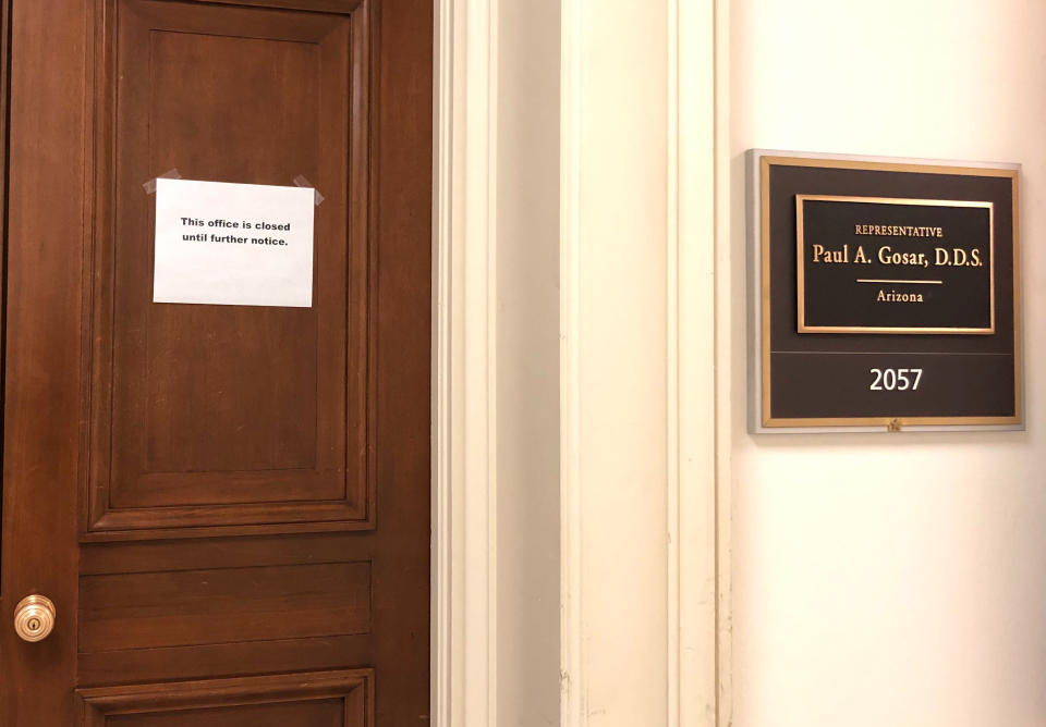 The Capitol Hill office door of Rep. Paul Gosar, R-Ariz., has a sign that reads, "This office is closed until futher notice," shown Monday, March 9, 2020 on Capitol Hill in Washington. On Sunday, Sen. Ted Cruz, R-Texas, and Gosar said they're isolating themselves after determining they had contact with a person at a Maryland political conference who got COVID-19. (AP Photo/Padmananda Rama)