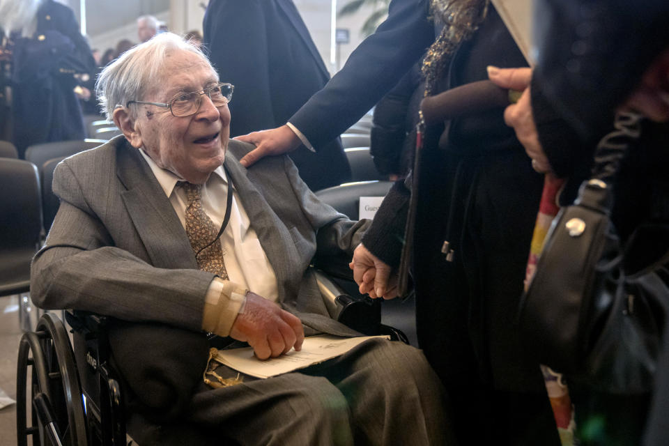 Ghost Army member Seymour Nussenbaum, of Monroe Township, N.J, talks with well-wishers after a ceremony to honor members of their secretive WWII-era unit with the Congressional Gold Medal on Capitol Hill, Thursday, March 21, 2024, in Washington. (AP Photo/Mark Schiefelbein)