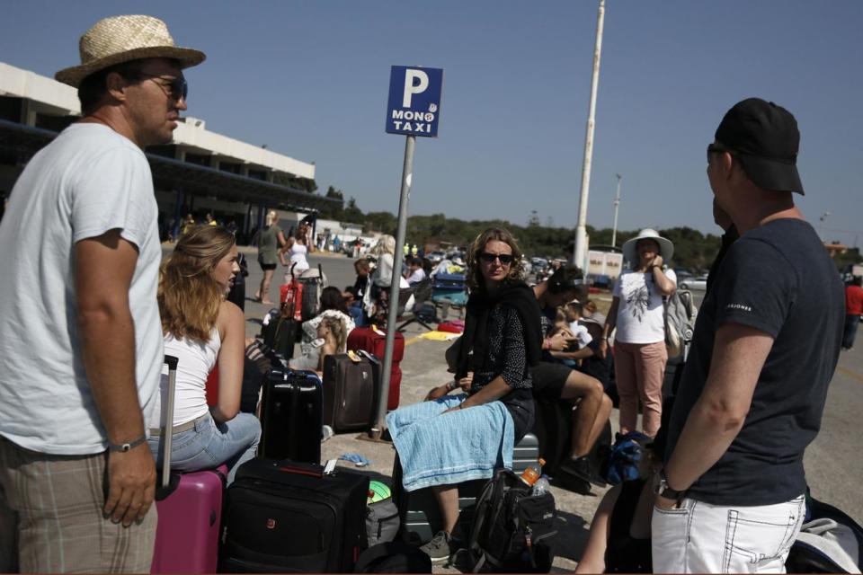 Tourists wait at Kos airports after a killer earthquake struck Greek holiday islands (Reuters)