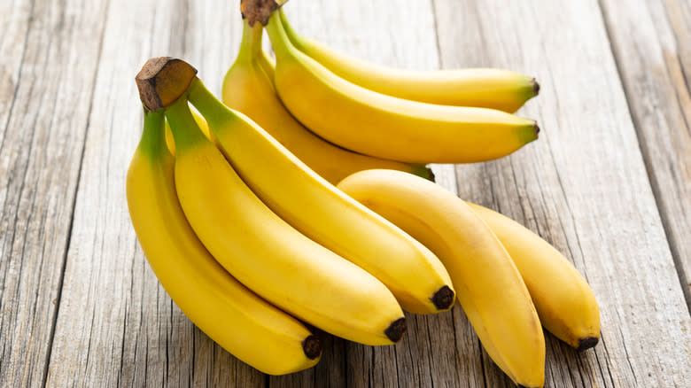 Yellow green bananas on a table