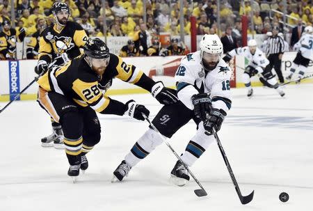 May 30, 2016; Pittsburgh, PA, USA; San Jose Sharks center Patrick Marleau (12) battles for the puck with Pittsburgh Penguins defenseman Ian Cole (28) in the third period in game one of the 2016 Stanley Cup Final at Consol Energy Center. Mandatory Credit: Don Wright-USA TODAY Sports