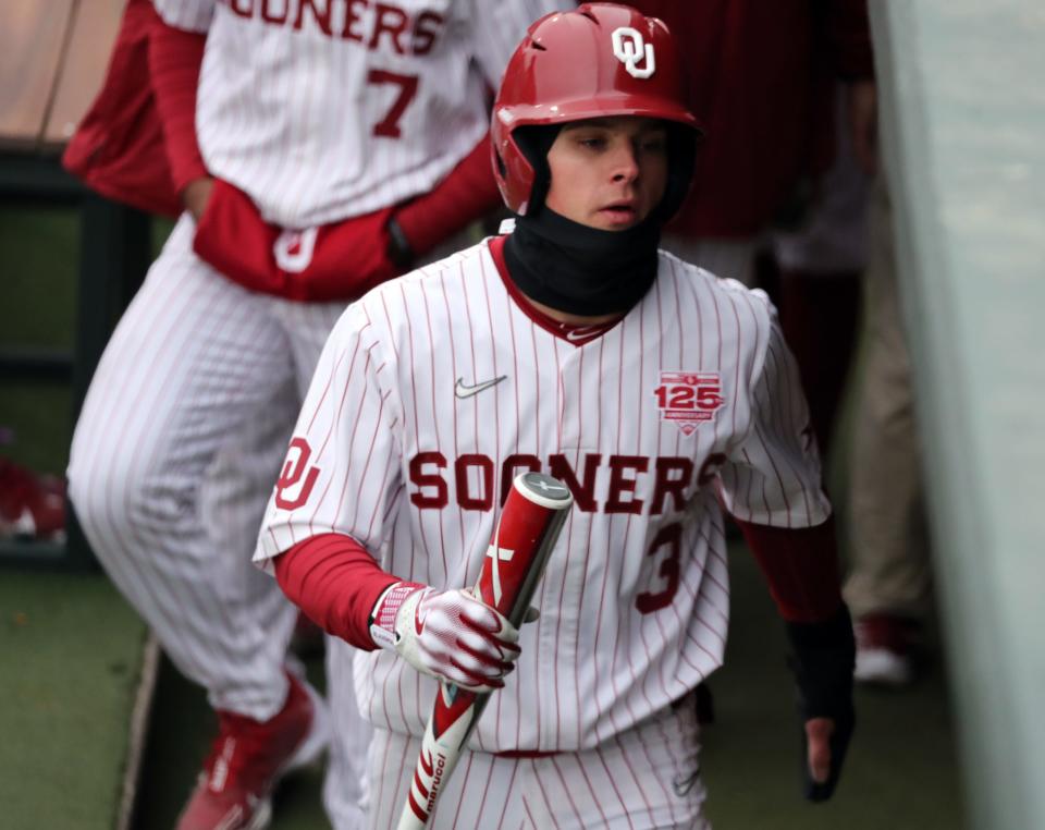 OU's Anthony Mackenzie enters the dugout during a game against Rider at L. Dale Mitchell Park in Norman on Feb. 24.